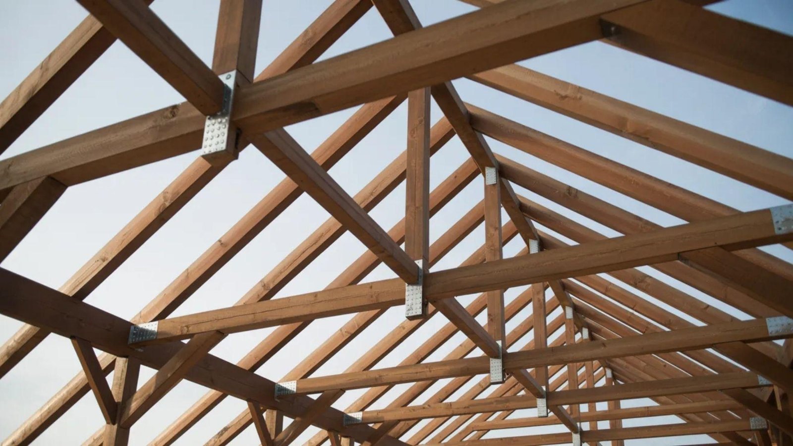 Aerial view of the wooden structure's roof, showcasing its natural texture and design.